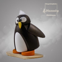 Pinguin auf Snowboard