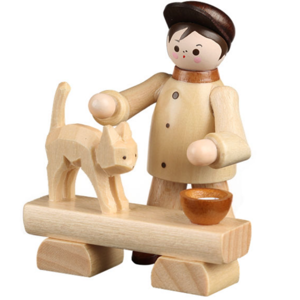 Junge füttert Katze