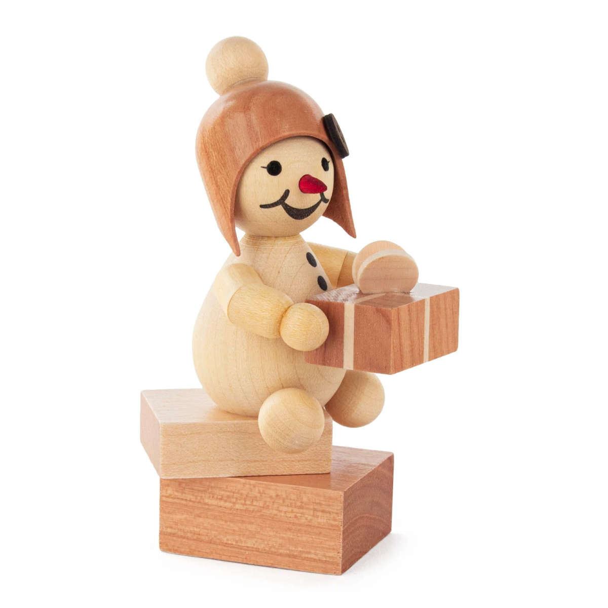 Schneemädchen "mit Geschenk" sitzend